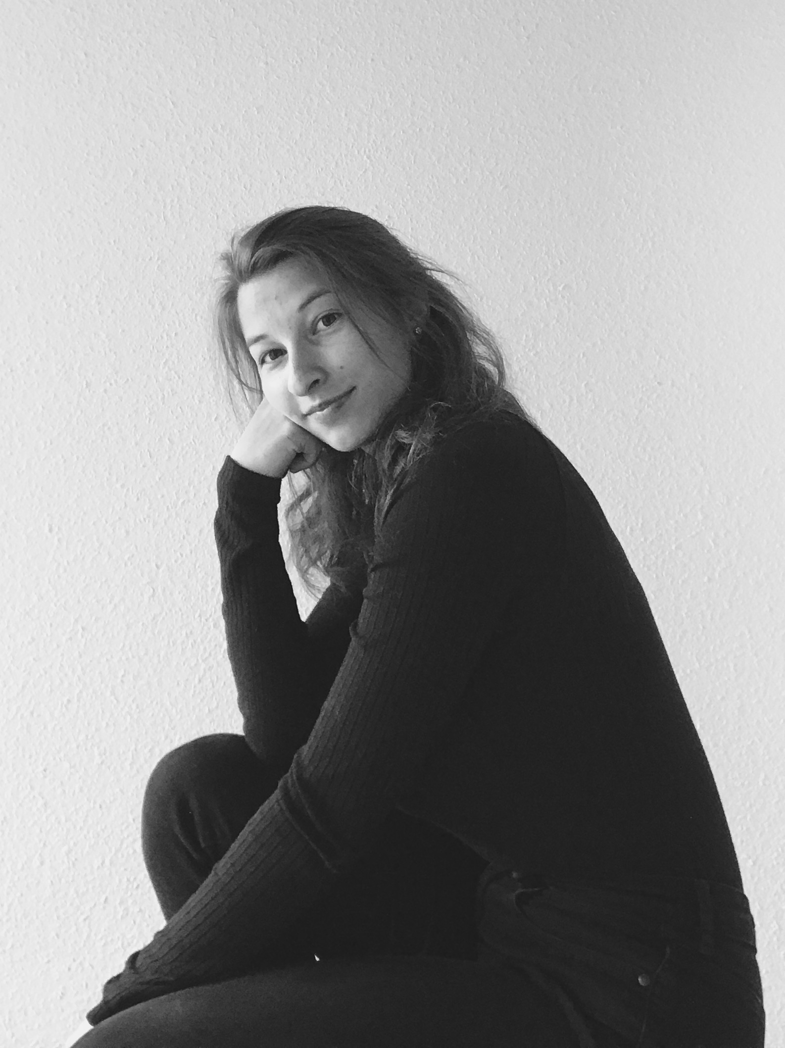 Black and white portrait of Céline smiling