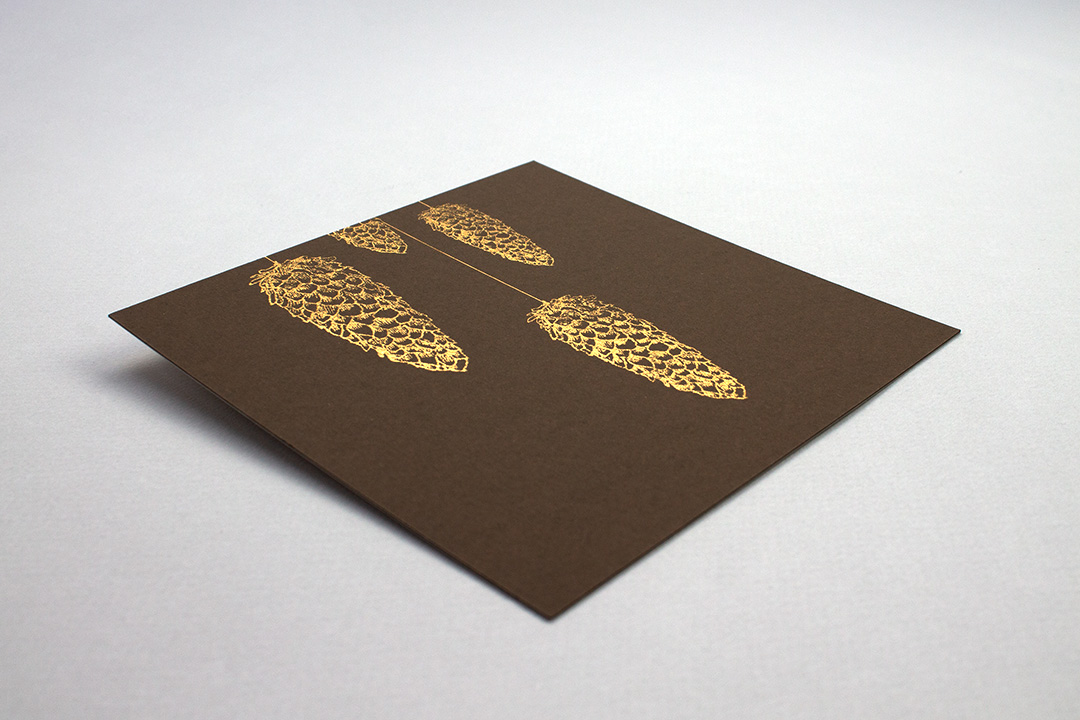 foil embossed card with pine cones
