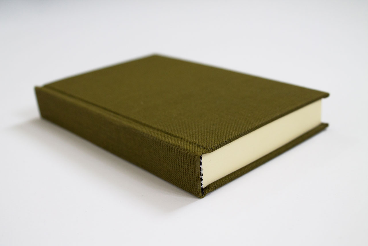 green linen hardcover on a white background