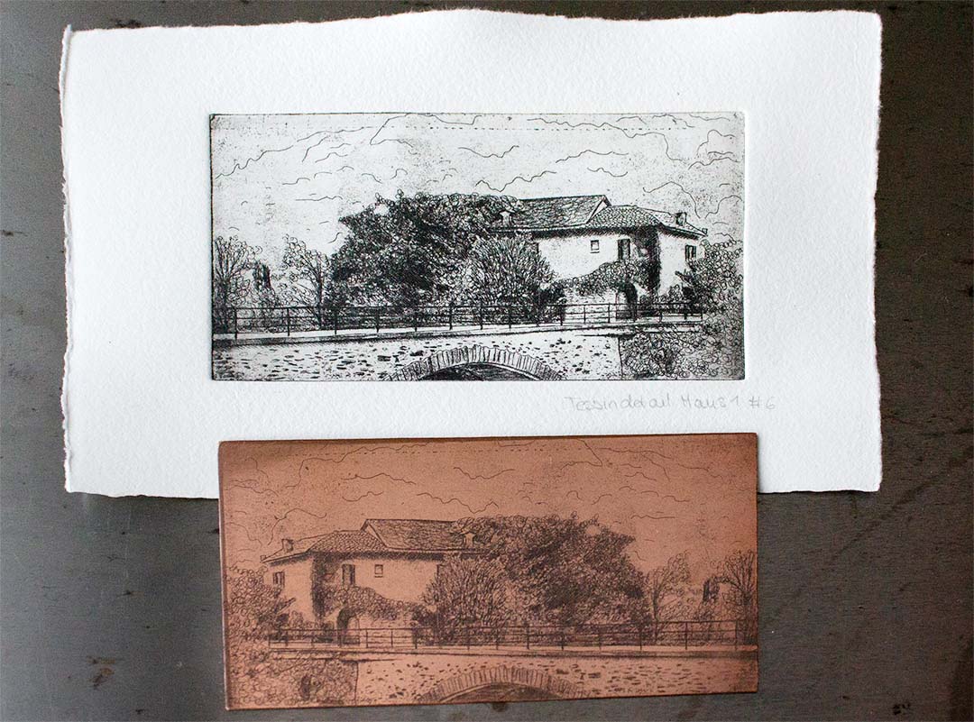copper plate with a mediterranean house etched in it