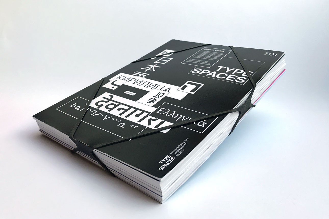 a rubber band bundles eleven magazines over four sides