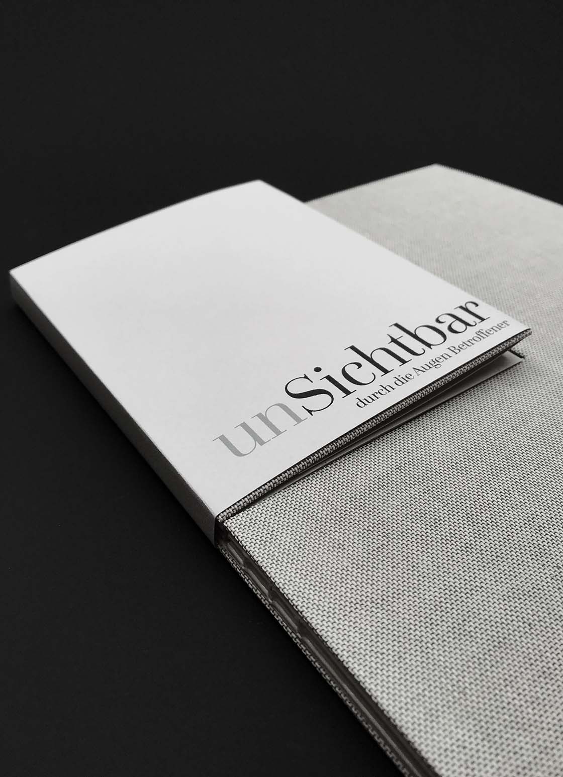 Experimental bookbinding project –  linen book cover with a smaller cover opening seperately