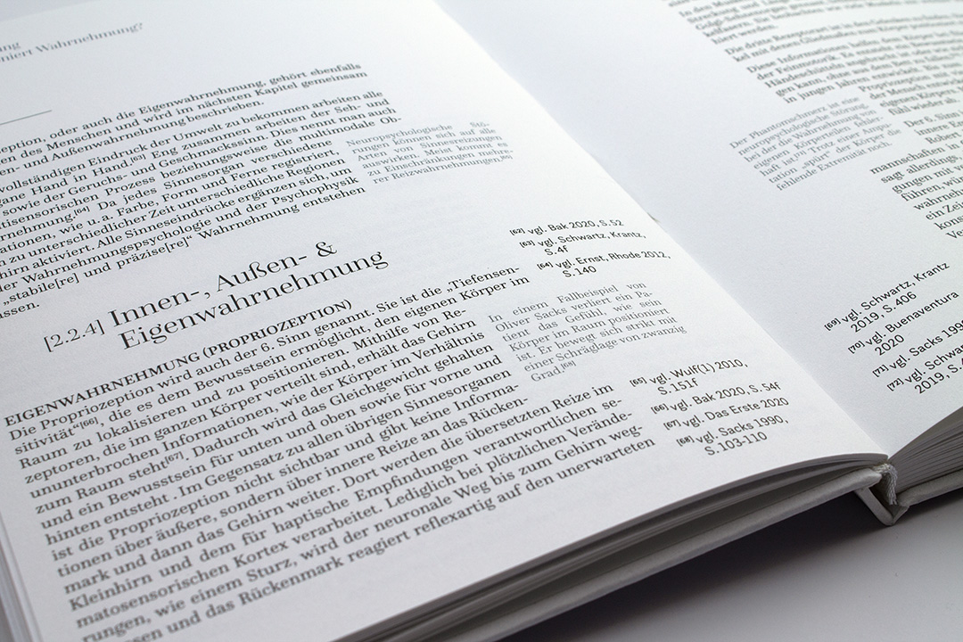 opened book with text details and marginals